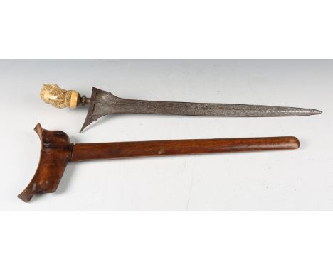 A 19th century Javanese kris dagger with fine watered steel blade of straight double-edged form, blade length 38cm, gilt meta