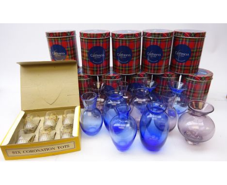 Eleven Caithness amethyst and sapphire glass vases, with original tin boxes and a set of six boxed Coronation tots 