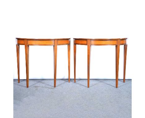 Pair of mahogany and satinwood demi lune console tables, sunburst veneered tops with boxwood and ebony stringing, square tape