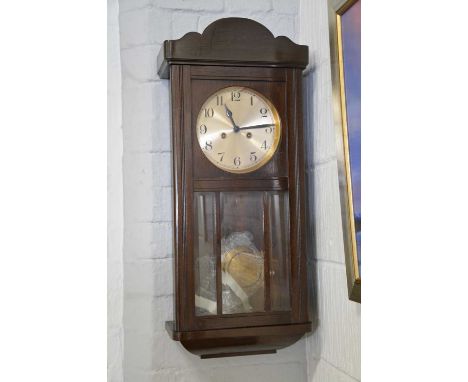 Oak cased wall clock, silvered dial, the movement striking on a gong, 76cm.Condition report:The clock is sold as untested.