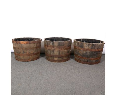 Seven half barrel garden planters, some of the coppering loose, each diameter 65cm, height 44cm.Qty: 7