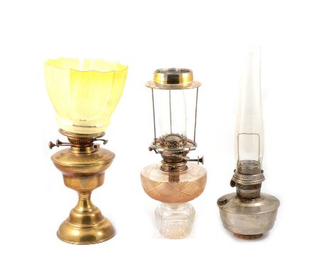 Cut glass oil lamp, Hinks No 2 Lever; a brass oil lamp, etched graduating yellow glass shade; and another adapted lamp base.Q