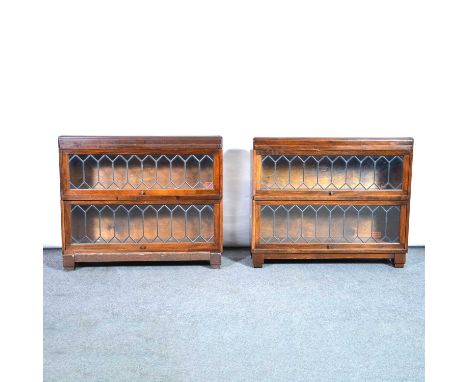 Four Globe Wernicke bookcase sections, leaded and glazed doors, width 86cm, depth 25cm, height 27cm, two plinth bases and two