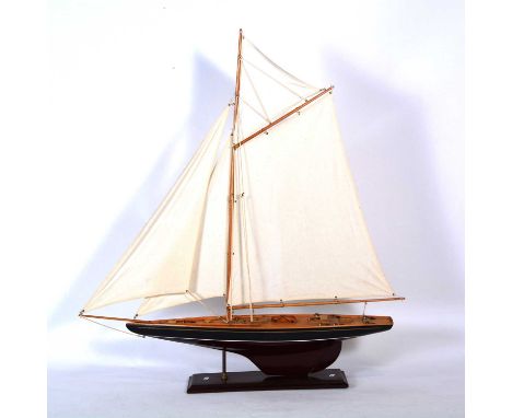 Model of a pond yacht, mounted on a plinth, height 98cm.