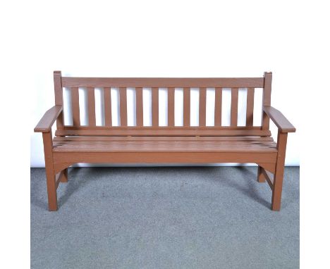 Stained teak garden bench, and two matching chairs.