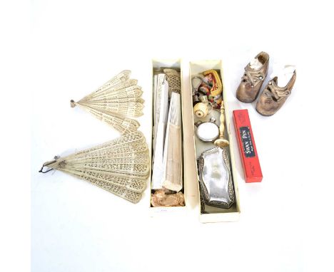 A collection of six fans,bone, simulated bone, and wooden sticks; a pair of infants shoes, circa 1930's, worn hide, 11cm, wit