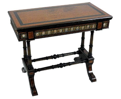 A Victorian amboyna boxwood strung and ebony crossbanded and gilt metal mounted porcelain inset card table, the rectangular f