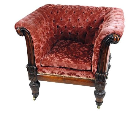 A William IV rosewood framed enclosed armchair with later claret upholstered button down back sides and with squab cushion wi