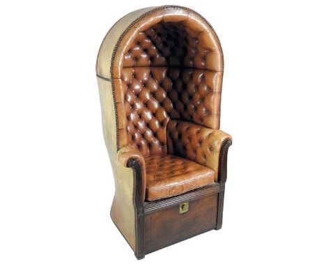 A Regency mahogany hall porters chair, the enclosed button down faded brown leather canopy with close studded borders and squ