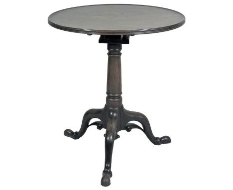 A George III mahogany tripod table, the dished and reeded circular, revolving tilt top with four pillar 'bird cage' action on