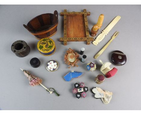 A selection of treen and ivory items to include miniature parasol, small beadwork pin cushions and reels and an ivory table c