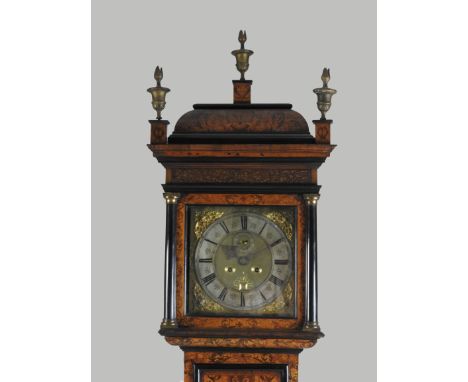 An early 18th century walnut and seaweed marquetry month duration longcase by Edmund Day, London, the caddy-topped hood is su