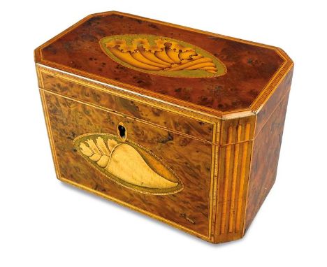 A George III boxwood and harewood inlaid two division tea caddy, the canted rectangular top inlaid with a conche shell motif 