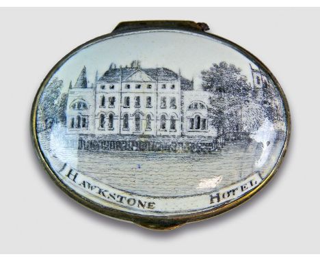 A rare oval enamel patch box, Regency, the cover painted en grisaille with a titled view of Hawkstone Hotel enclosing a mirro