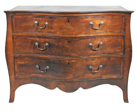 A George III crossbanded mahogany serpentine front commode, circa 1780, the bevelled top above three crossbanded and cockbead