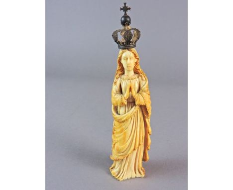 An Indo-Portuguese carved ivory figure of Our Lady of the Conception, 17th/18th century, wearing a white metal open crown wit