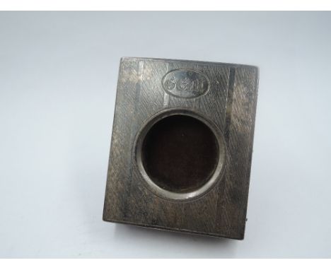 A small silver watch stand having engine turned decoration and monogrammed cartouche to silver front, Birmingham 1918, Willia