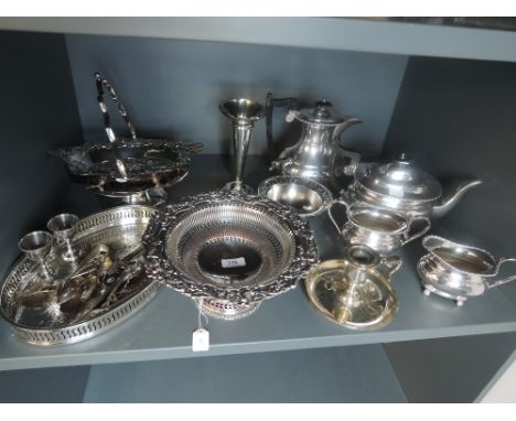 A selection of silver plate including chamber stick, four piece tea set, gallery tray, table basket etc