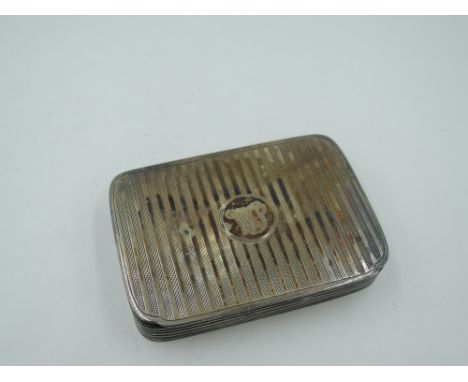 A silver snuff box having engine turned stripe decoration, moulded sides and gilt interior, Birmingham 1912, makers marks wor