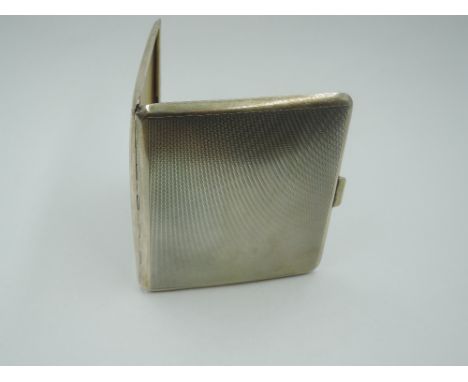 A 1930's silver cigarette case of slim form having engine turned decoration and bearing dated monogram to inside, Birmingham 