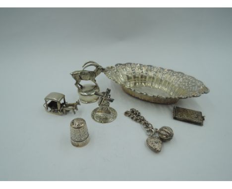 A small selection of HM silver and white metal including oval trinket dish, DORCAS thimble, study of a mountain goat, windmil