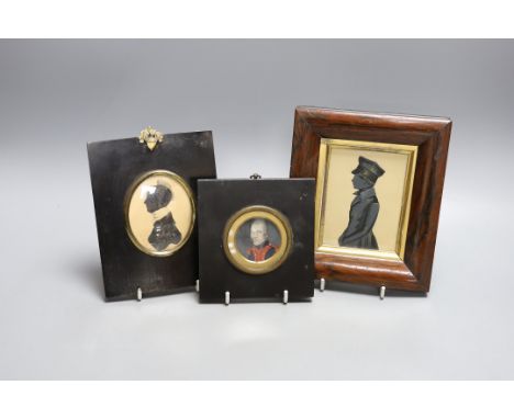 An unusual portrait miniature of a 19th century gentleman wearing earrings, together with two framed silhouettes (3)
