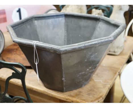 An octagonal lead garden planter, width 44cm, height 25cm