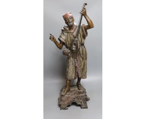 A late 19th French cold painted spelter model of an Arab playing a string instrument - 57.5cm tall