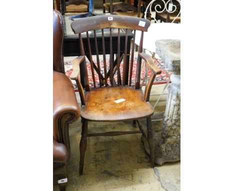 A Victorian elm and beech Windsor comb back elbow chair, width 53cm, depth 42cm, height 93cm