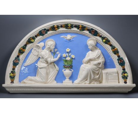 A Della Robbia style ceramic door pediment, 57.5cm wide