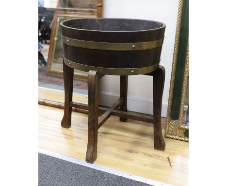 An early 20th century coopered oak planter and separate stand, stamped mark