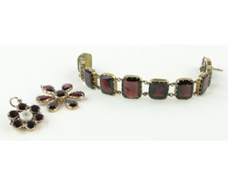 A Georgian garnet, pearl and diamond pendant,
18mm across together with a garnet set gold pendant and a bracelet, (3).