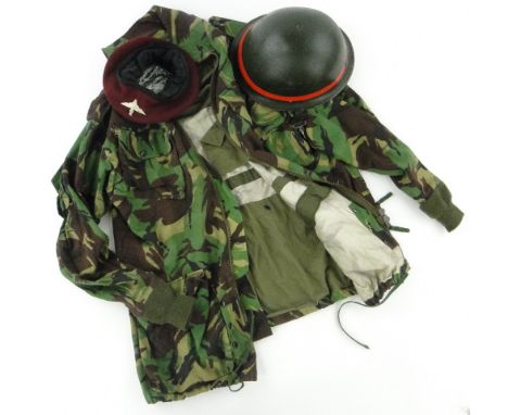 A 1979 MPs turtle helmet, 
and a British Army issue Para smock with beret and wings badge.