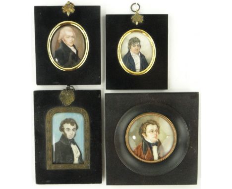 A 19th century watercolour portrait of a young man
in black frame with embossed brass mount, height 6", oval portrait of a ge