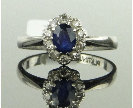 A platinum, sapphire and diamond cluster ring circa 1920s,
setting height 9mm, size K.