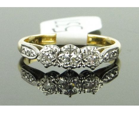 18ct gold and platinum 3 stone diamond ring,
with small diamond set shoulders, size K.