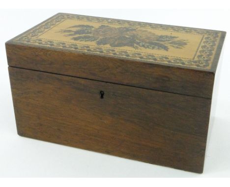 A Tunbridgeware tea caddy
with floral design to the lid and fitted interior, length 8.5".