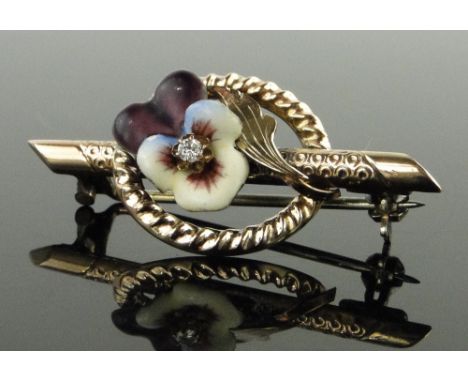 Unmarked gold diamond and coloured enamel floral bar brooch,
length 38mm.