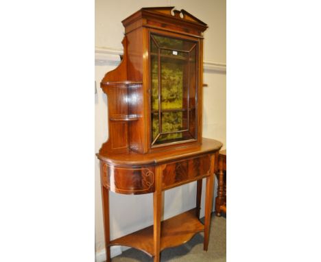 A Victorian mahogany bookcase,
having a single lattice glazed door with cupboard and shaped shelf under, allover satinwood cr