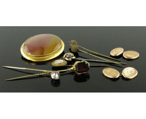 Box of various jewellery,
including gold cufflinks, polished stone and gold brooch and various stick pins.