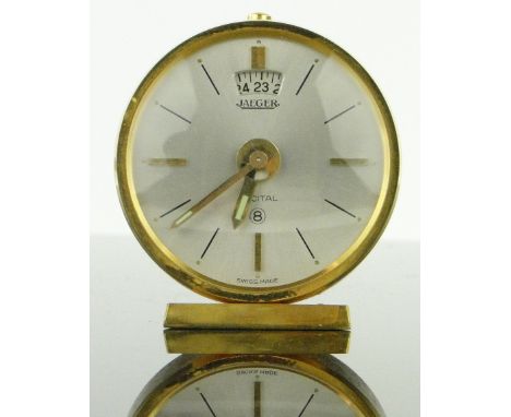 A Jaeger gilt metal cased travelling alarm clock,
with original carrying case, case width 45mm.