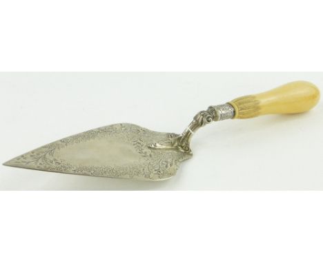 A Victorian engraved silver trowel,
with carved ivory handle, Sheffield 1886, length 32cm.