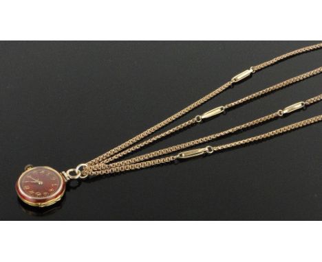 A 9ct gold red enamel and diamond pendant watch,
on long 9ct gold guard chain, case width 26mm, chain 32g.