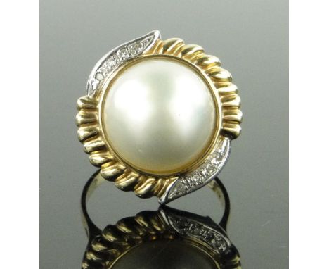 Large 9ct gold pearl set ring,
with diamond set surround, setting height 20mm, size P.