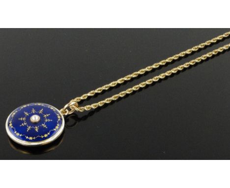 A Victorian 15ct gold blue and white enamel locket,
with central pearl, 23mm across on gold chain.