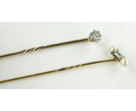 2 18ct gold diamond set stick pins.