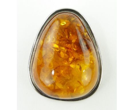 A large amber set silver pendant/brooch,
height 65mm.