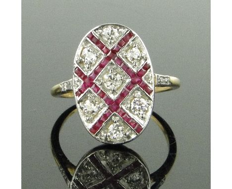 18ct gold calibre cut ruby and diamond set oval panel ring,
panel height 17mm, size L.