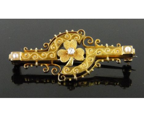 A Victorian 18ct gold diamond and pearl shamrock design brooch,
length 42mm.