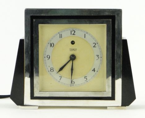 A Temco chrome and black bakelite electric mantel clock, GWO.